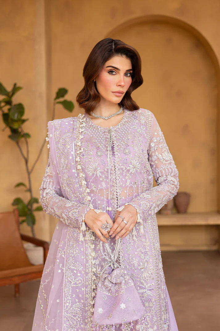 Lilac organza embroidered dress with dupatta and raw silk trousers.