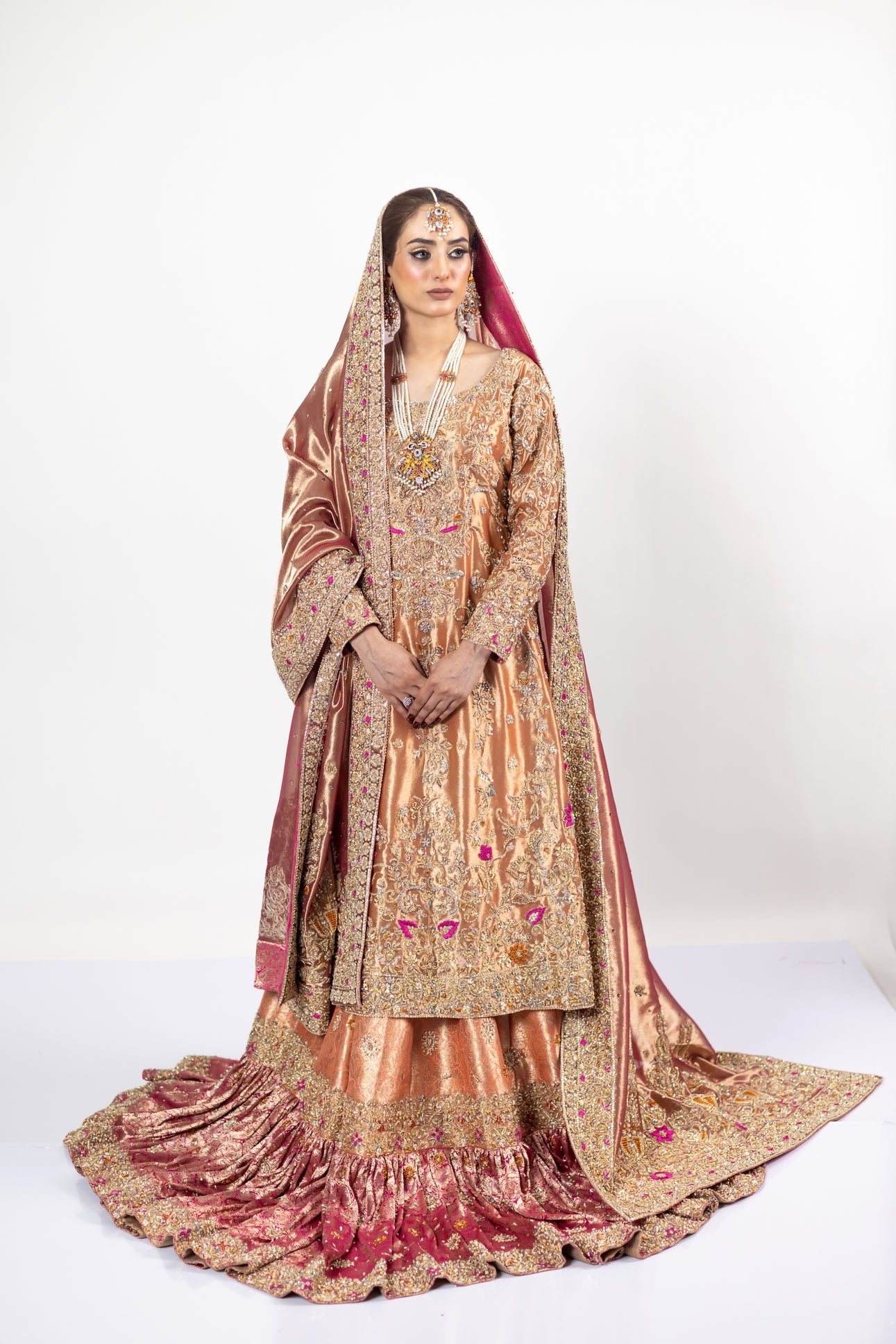 Afsheen bridal outfit by MariamRaj: Peach gold or magenta pink tissue silk Pishwas, Jamawar Gharara, delicate tissue dupatta, zardoze and resham embroidery for weddings