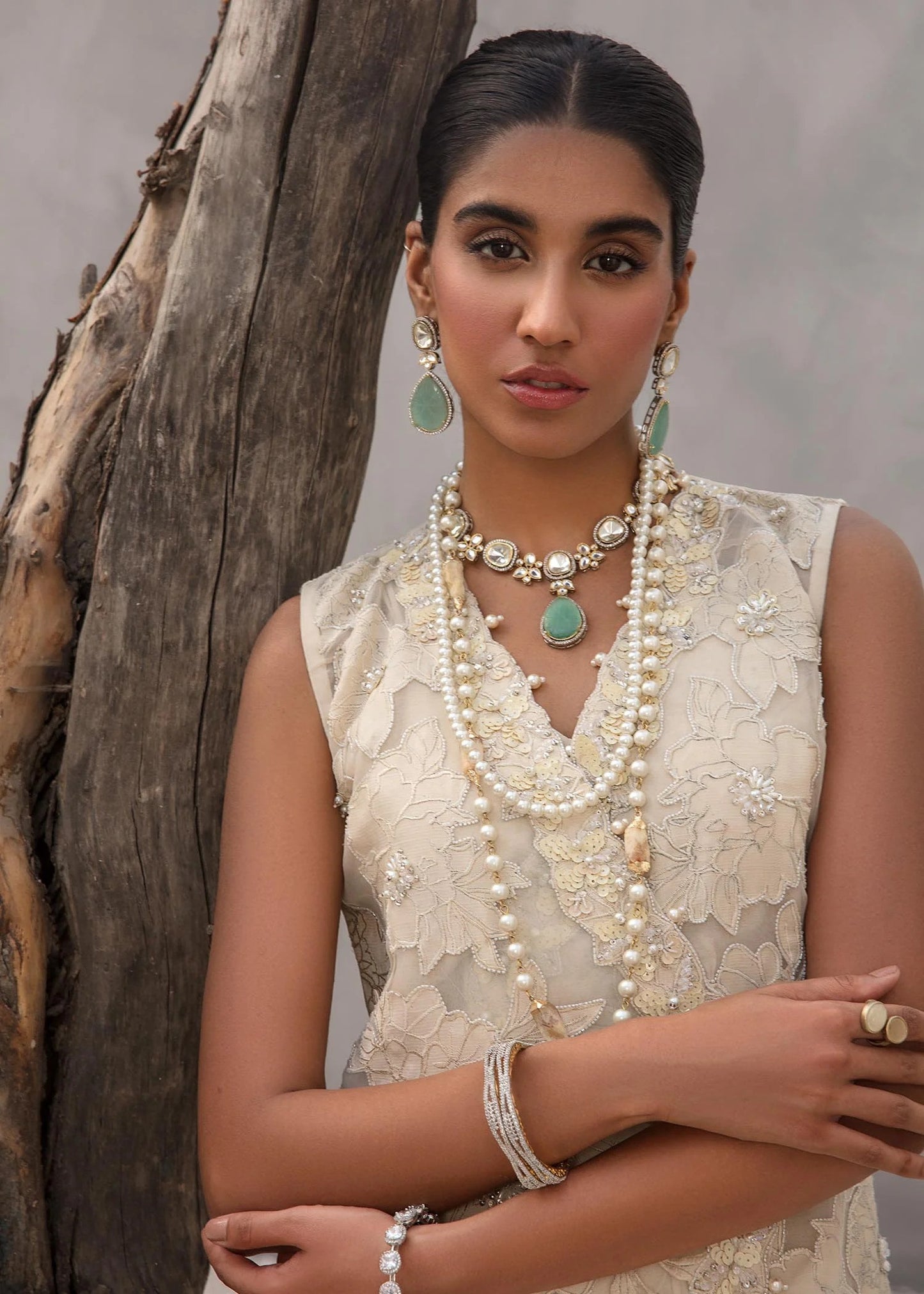 Angrakha crossover shirt in Korean raw silk with crystal florals and silk pants.