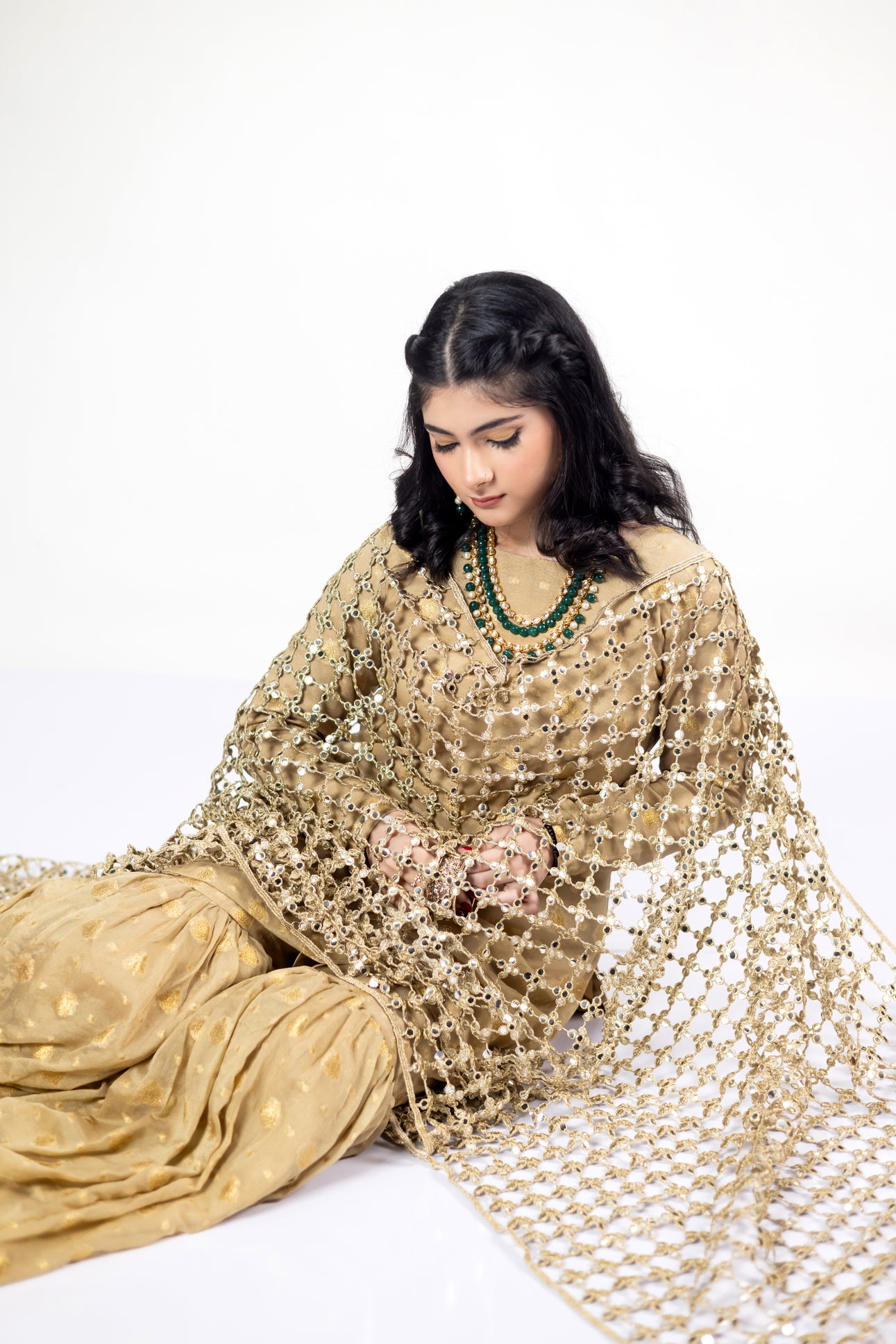 Gold Designer Frock & Gharara Set by MariamRaj with zardoze and resham embroidery for weddings and mehndi.