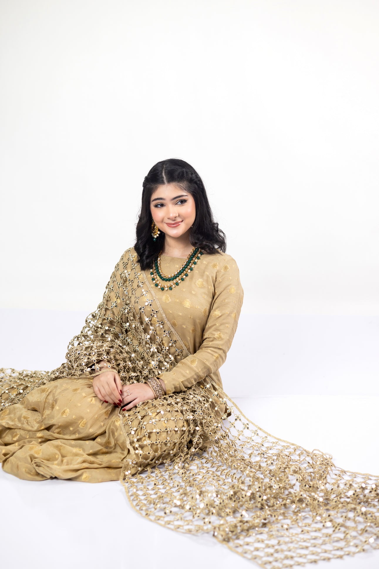 Gold Designer Frock & Gharara Set by MariamRaj with zardoze and resham embroidery for weddings and mehndi.