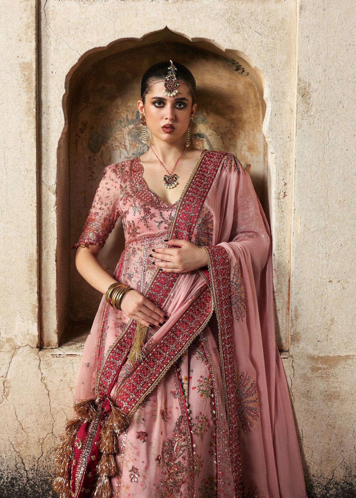 Model wearing Roshanara Rose Pink Organza Embroidered Pishwas with Lehenga and Chiffon Dupatta – Hussain Rehar Massarat Festive 2025 Collection.