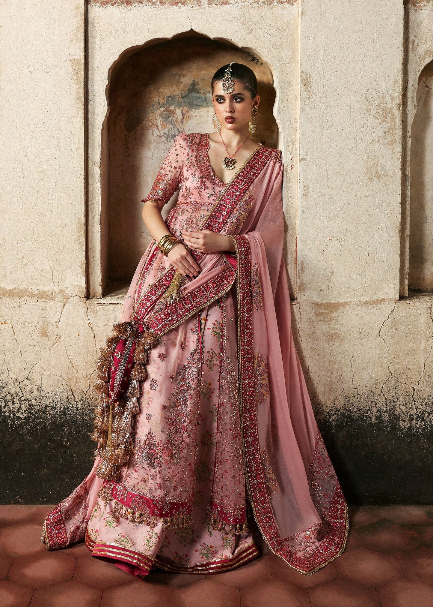 Model wearing Roshanara Rose Pink Organza Embroidered Pishwas with Lehenga and Chiffon Dupatta – Hussain Rehar Massarat Festive 2025 Collection.