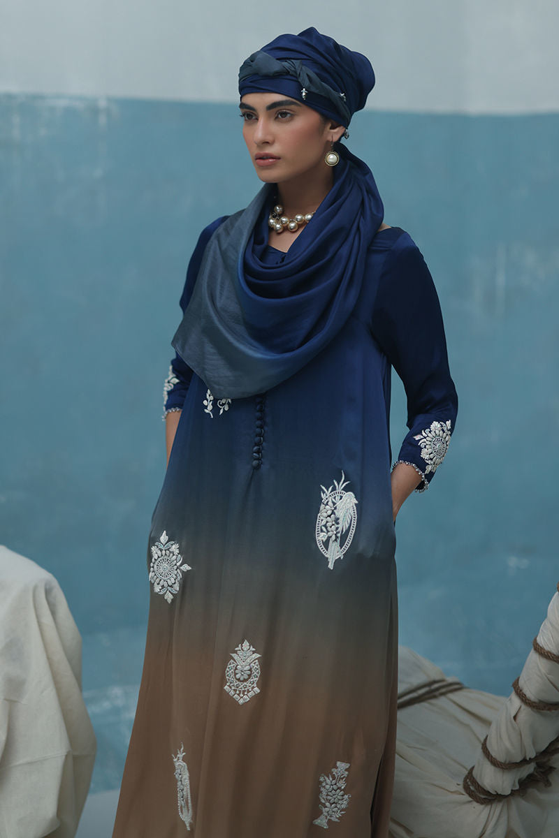 Blue Charmeuse silk kaftan with resham and crystal embroidery, paired with crepe silk pants and ombré silk scarf – Pakistani festive outfit.