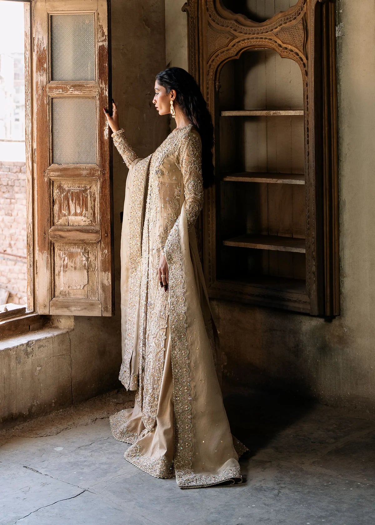 Zarnab nude stitched 4-piece outfit by Kanwal Malik with embellished open gown shirt, bustier, sharara, and organza dupatta for formal occasions.