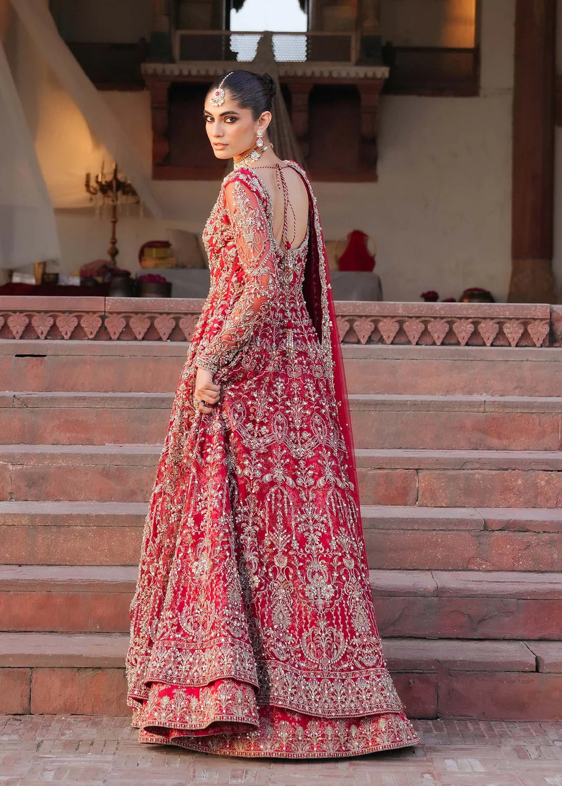 ARMAL – Red bridal pishwas with hand embroidery, Korean silk lehenga, and net dupatta. Stitched Pakistani bridal outfit online at Pakistanimoda.