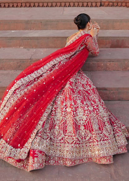 ARMAL – Red bridal pishwas with hand embroidery, Korean silk lehenga, and net dupatta. Stitched Pakistani bridal outfit online at Pakistanimoda.