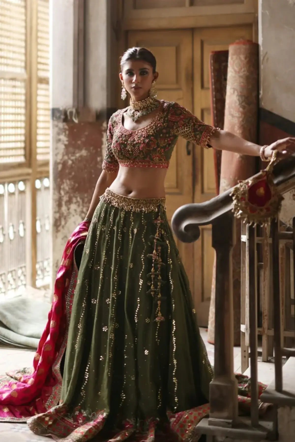 Aafrah Olive Green Silk Net Festive Lehenga Choli with Gold Pink Floral Embroidery, Pink Jamawar Dupatta and Embellished Pouch