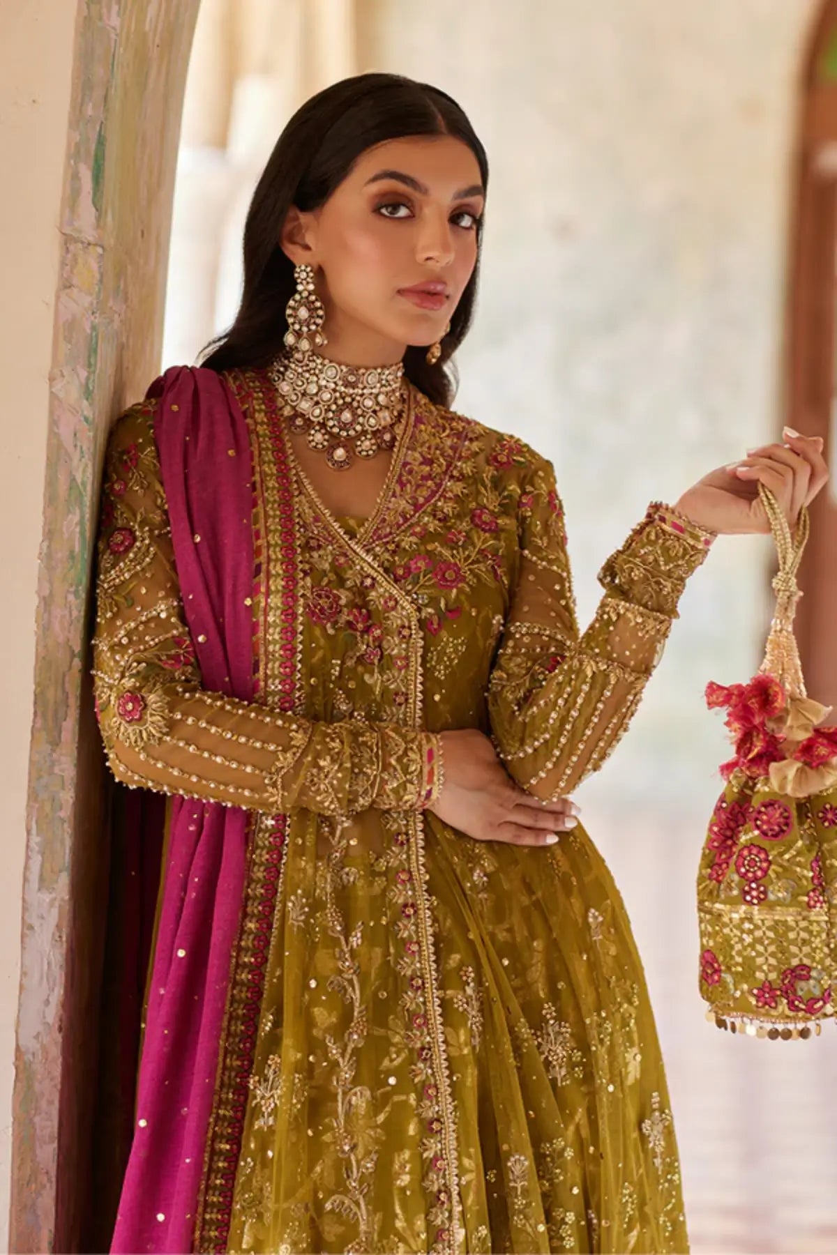 Aaliyah Olive Green Handworked Net Angrakha Mehndi Stitched Suit with Brocade Jamawar Pants, Magenta Khaddi Silk Dupatta and Embellished Pouch