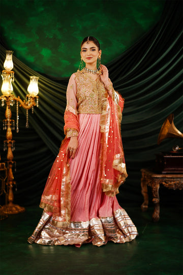 Abeer peach embellished organza blouse with Thai silk crushed palazzo and kamdani net dupatta by MariamRaj
