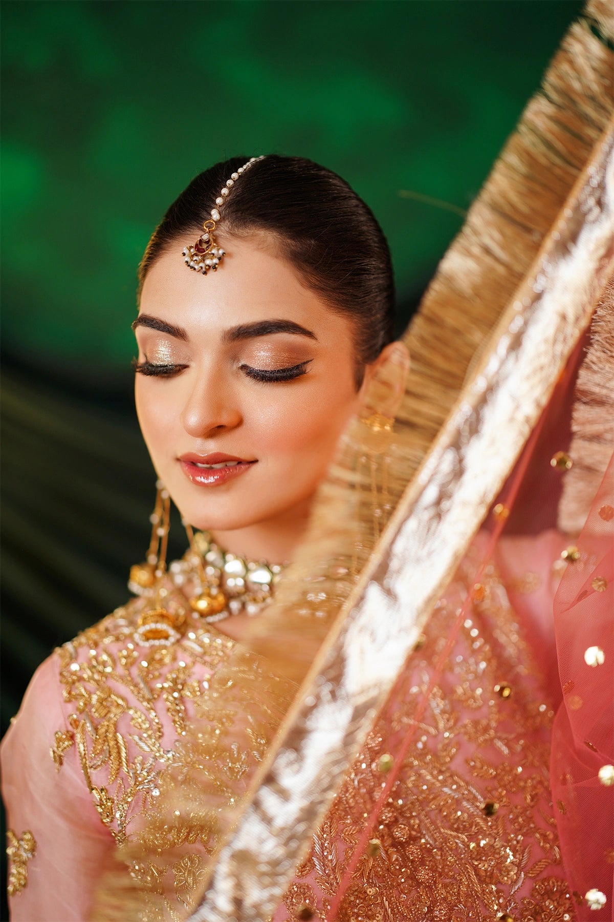 Abeer peach embellished organza blouse with Thai silk crushed palazzo and kamdani net dupatta by MariamRaj