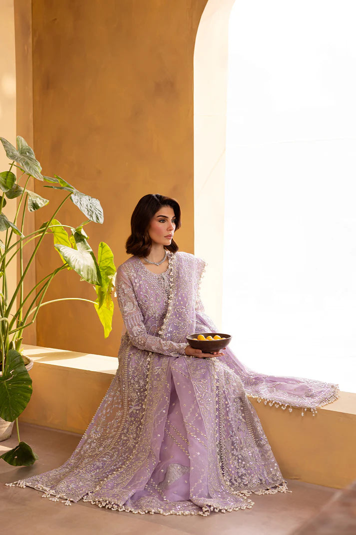 Lilac organza embroidered dress with dupatta and raw silk trousers.