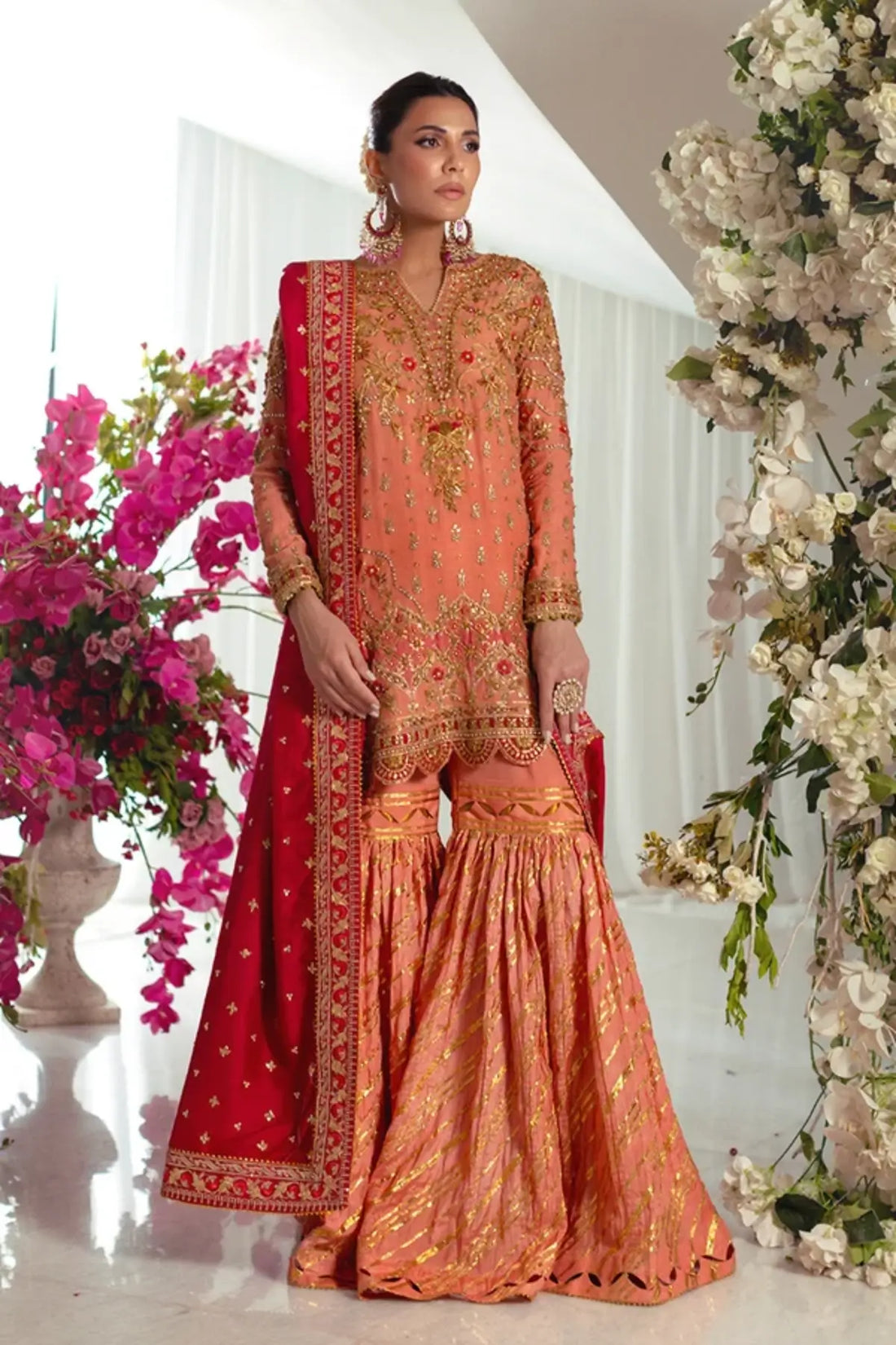 Afareen Peach Orange Embroidered Silk Net Sangeet Stitched Suit with Gold Embellishments, Cotton Silk Dhaka Pants and Red Raw Silk Dupatta