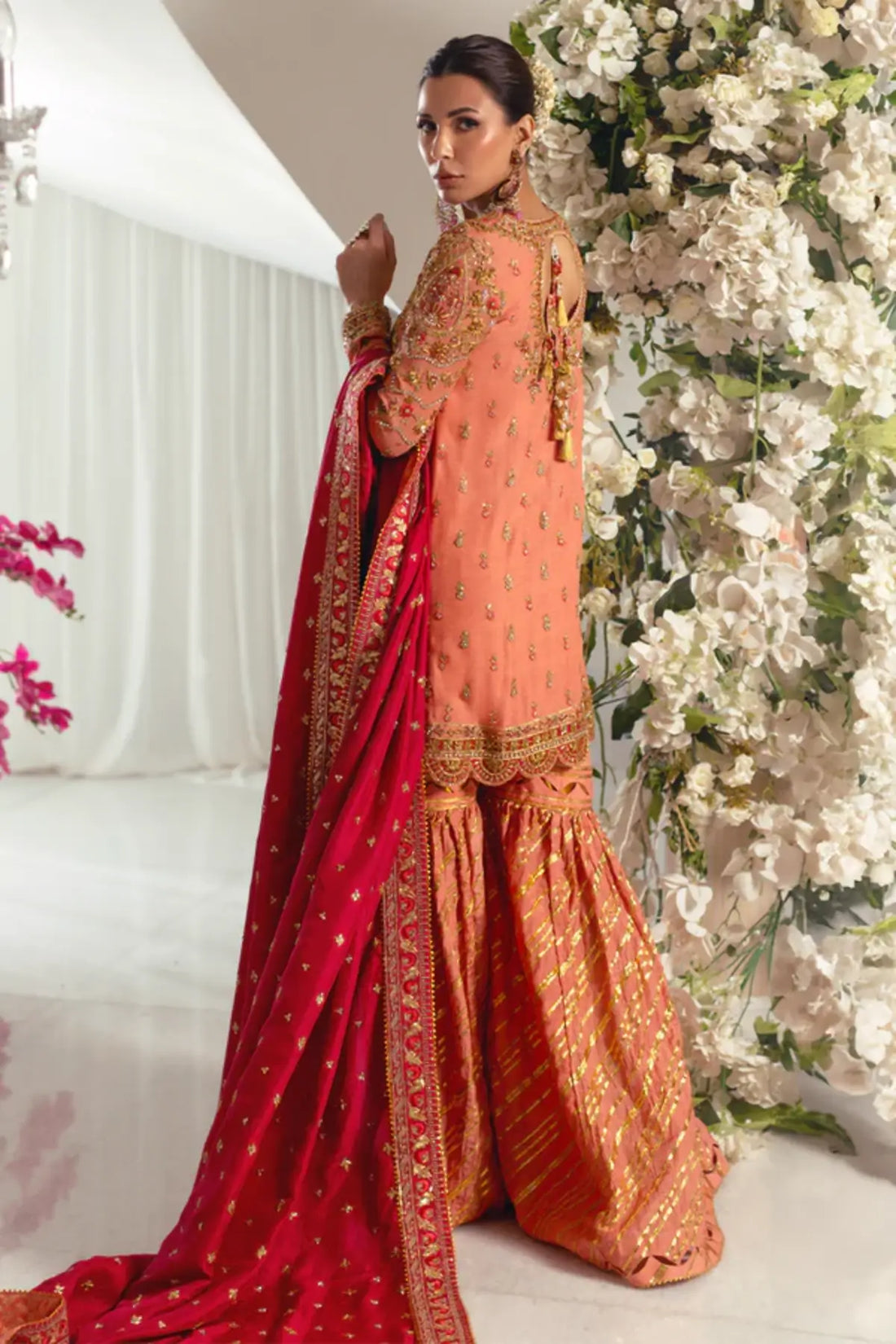 Afareen Peach Orange Embroidered Silk Net Sangeet Stitched Suit with Gold Embellishments, Cotton Silk Dhaka Pants and Red Raw Silk Dupatta