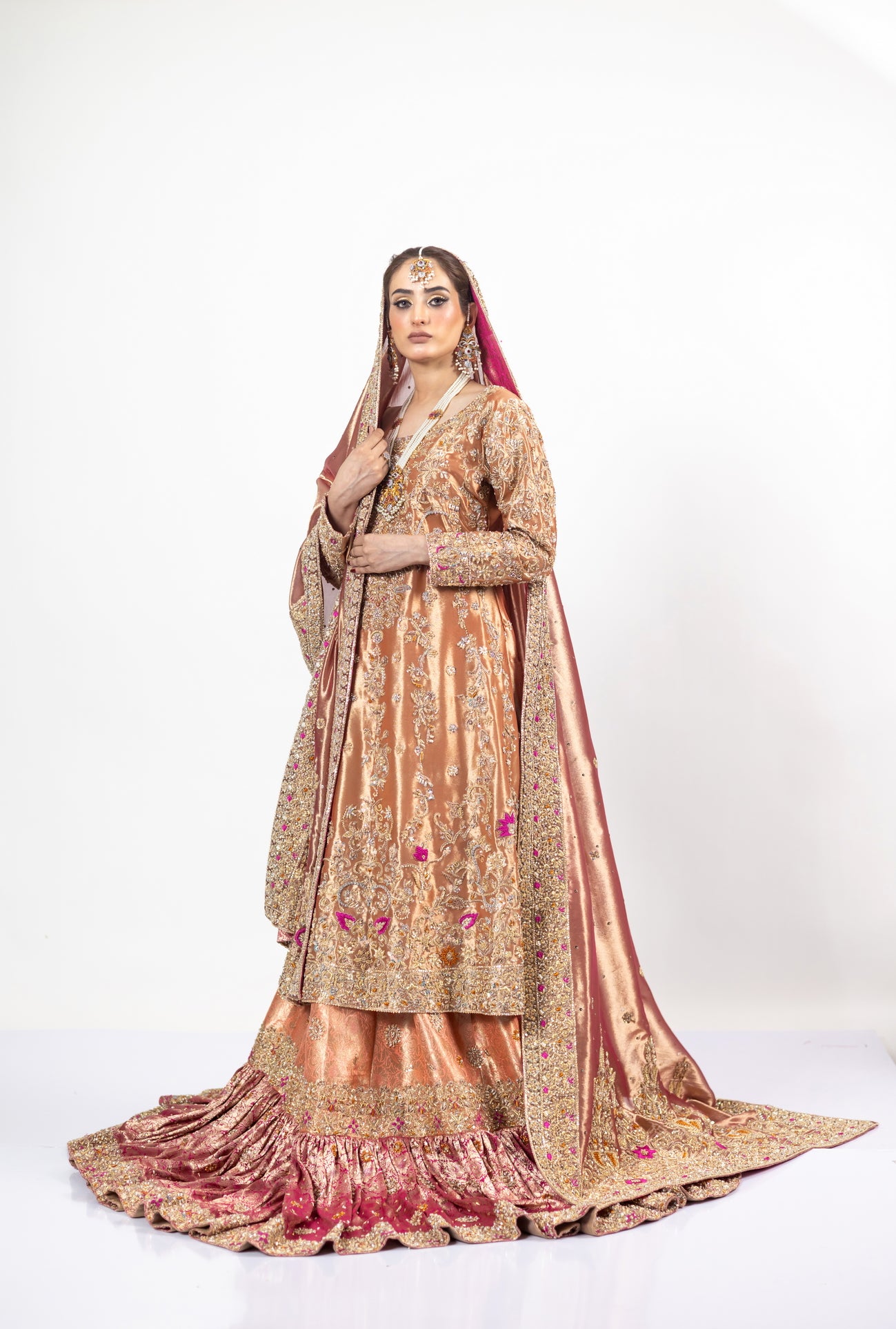 Afsheen bridal outfit by MariamRaj: Peach gold or magenta pink tissue silk Pishwas, Jamawar Gharara, delicate tissue dupatta, zardoze and resham embroidery for weddings