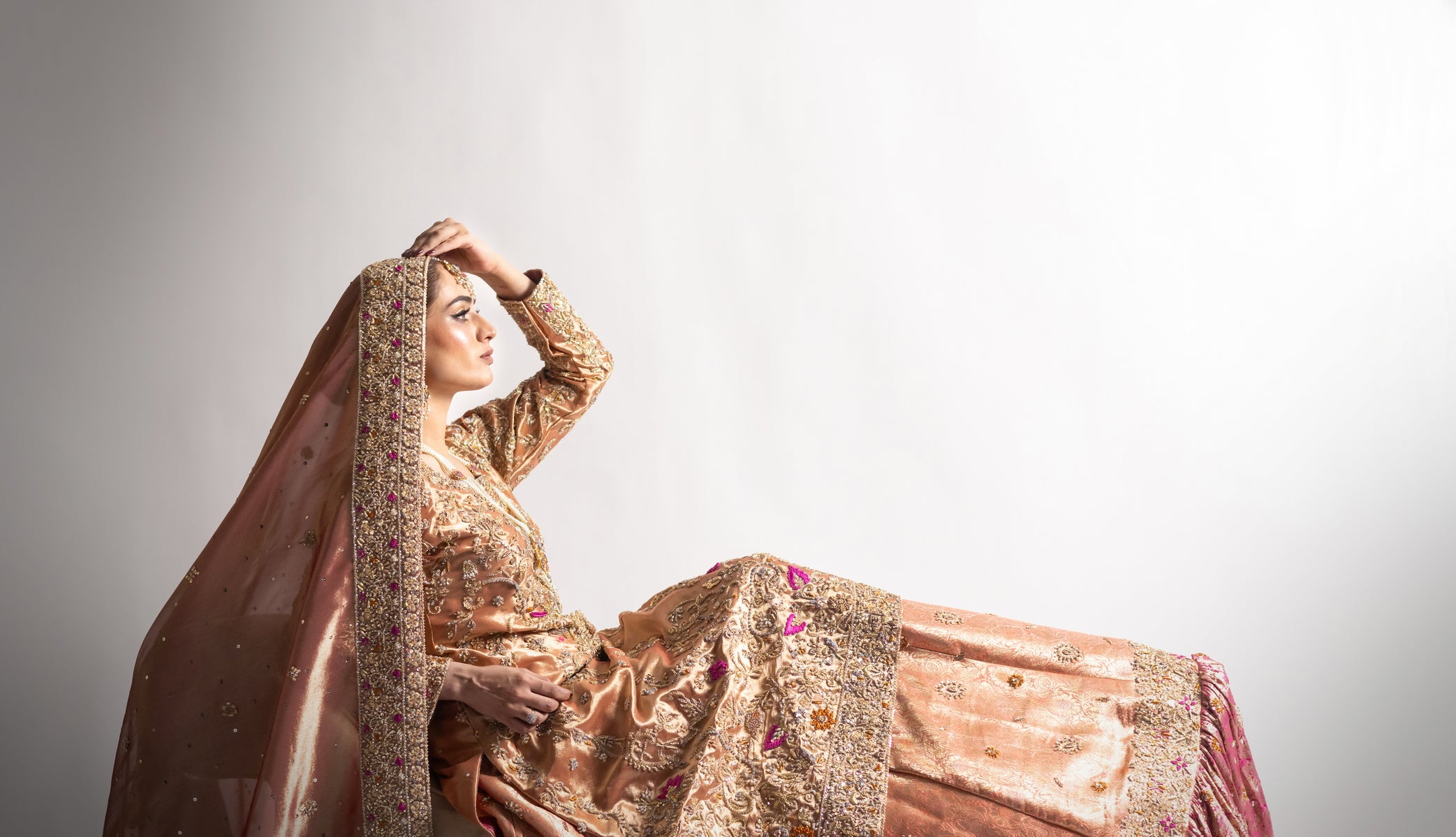 Afsheen bridal outfit by MariamRaj: Peach gold or magenta pink tissue silk Pishwas, Jamawar Gharara, delicate tissue dupatta, zardoze and resham embroidery for weddings