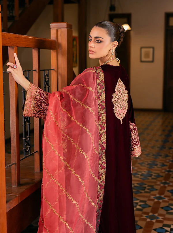 Aima Wine-Red Velvet Suit by Zainab Chottani with burnt-orange dupatta, luxury stitched outfit for winter events at Pakistanimoda.com.