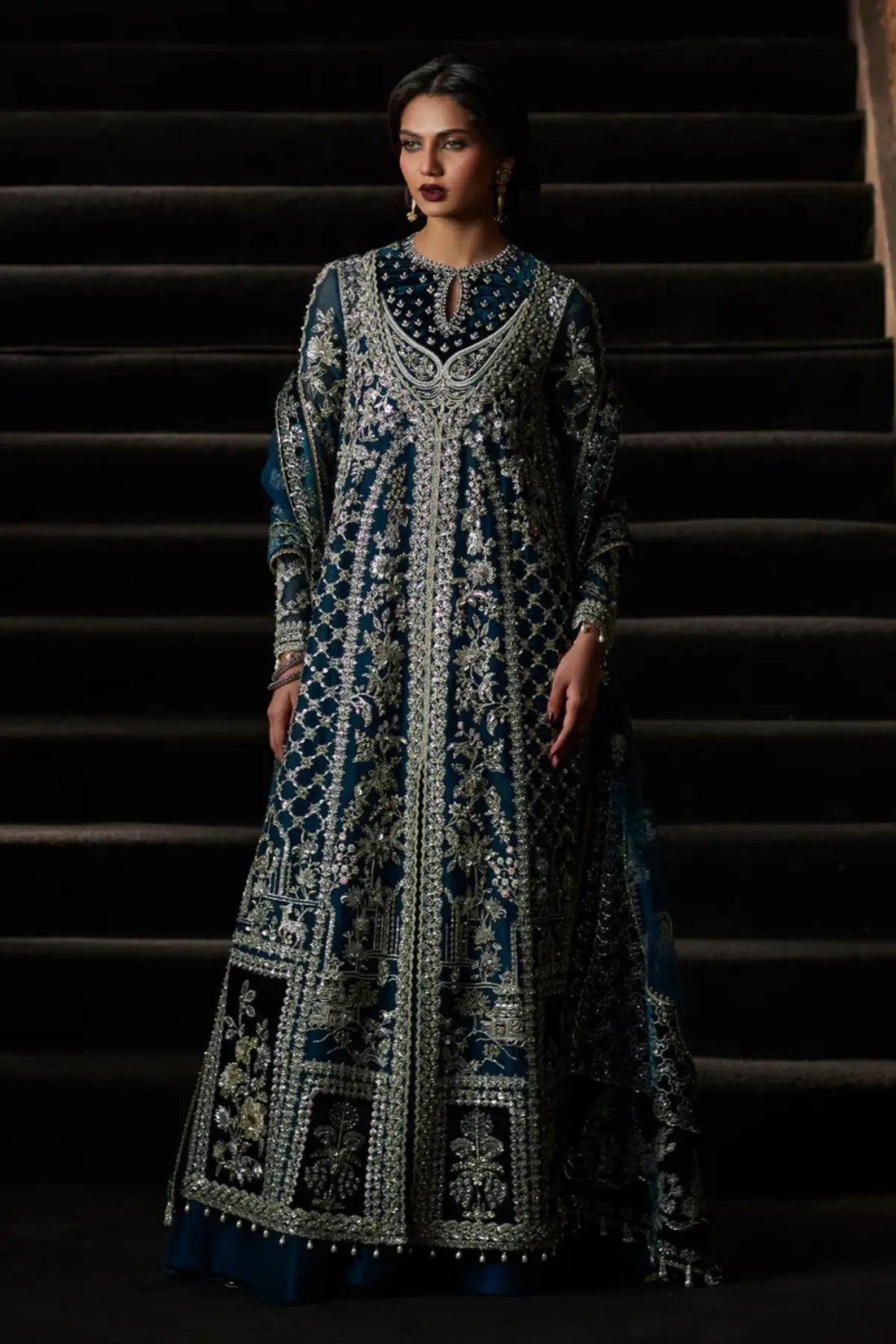 Alira deep teal front open gown formal suit by Saad Bin Shahzad with sharara and net dupatta featuring velvet borders