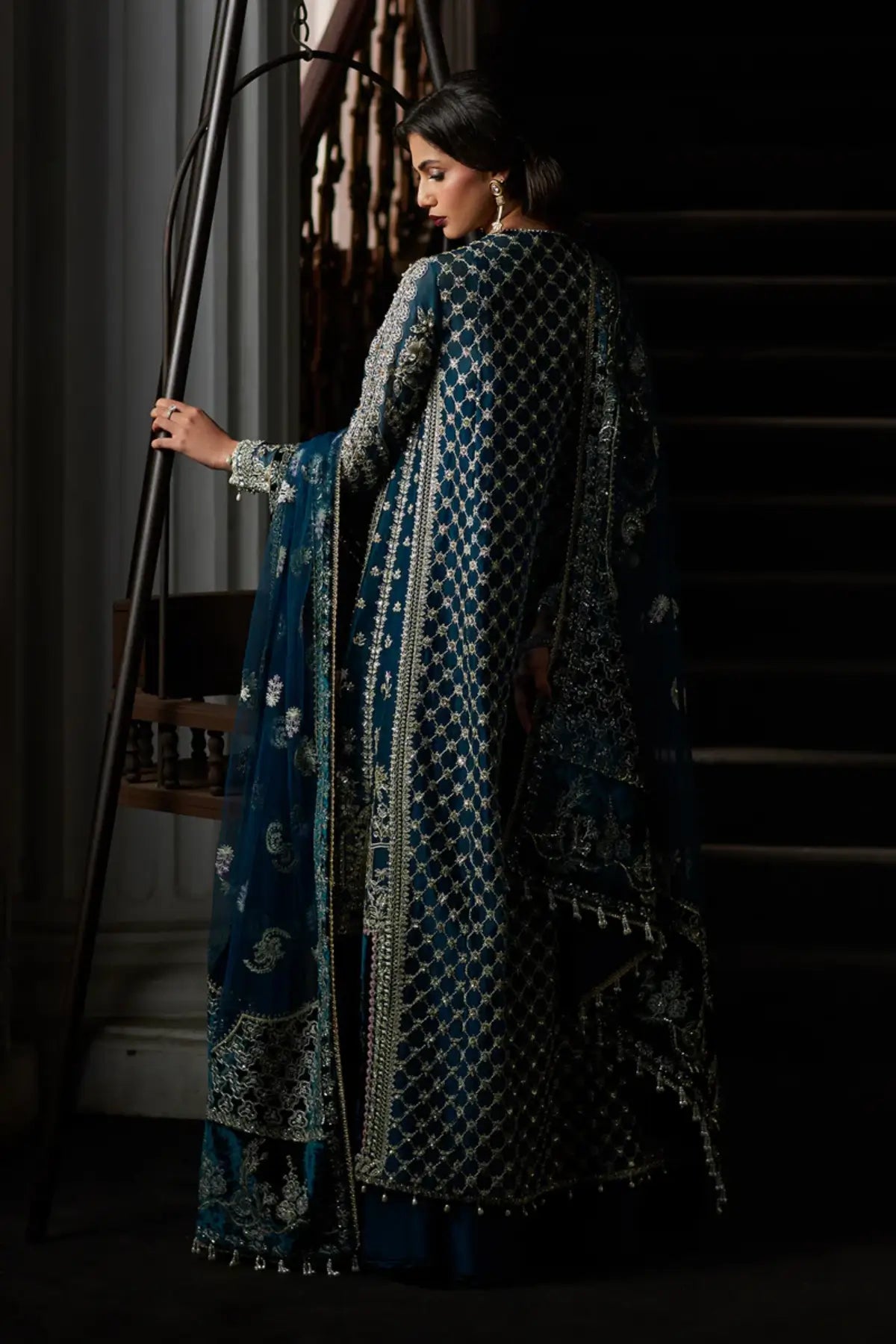 Alira deep teal front open gown formal suit by Saad Bin Shahzad with sharara and net dupatta featuring velvet borders