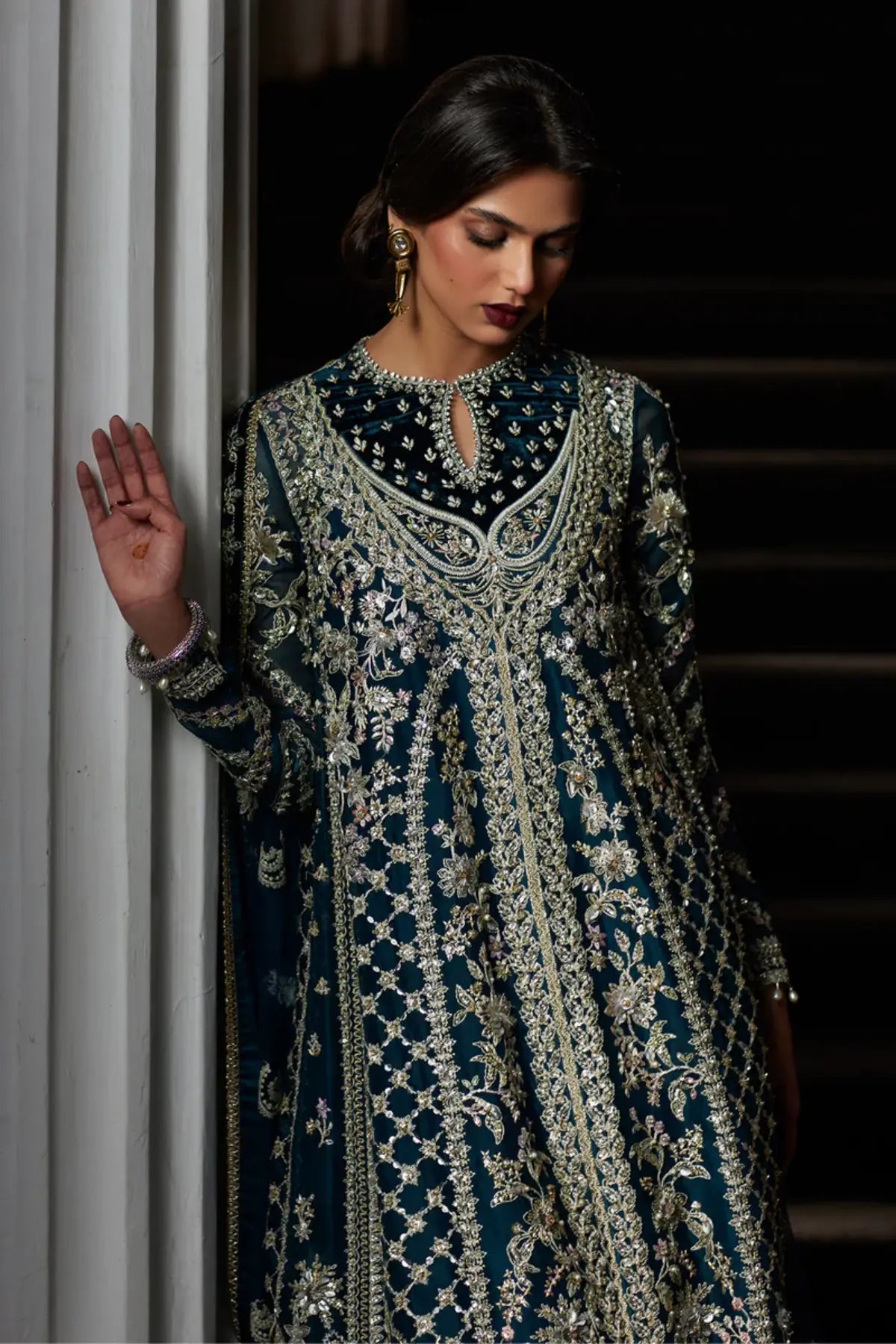 Alira deep teal front open gown formal suit by Saad Bin Shahzad with sharara and net dupatta featuring velvet borders