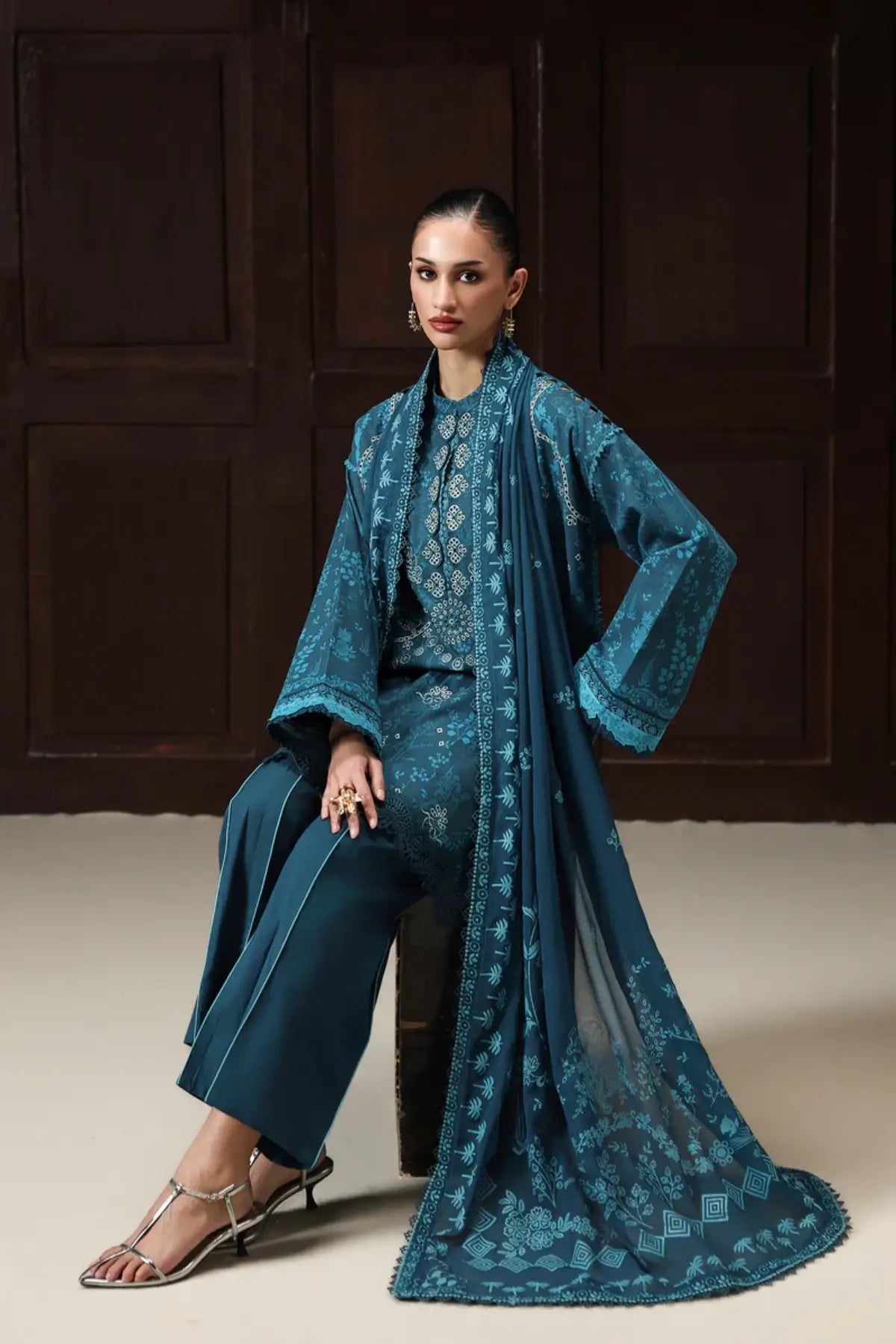 Alyra QQP-06(A) by Qalamkar teal blue lawn stitched 3PC suit featuring an embroidered front, printed chiffon dupatta, and plain cotton trousers.