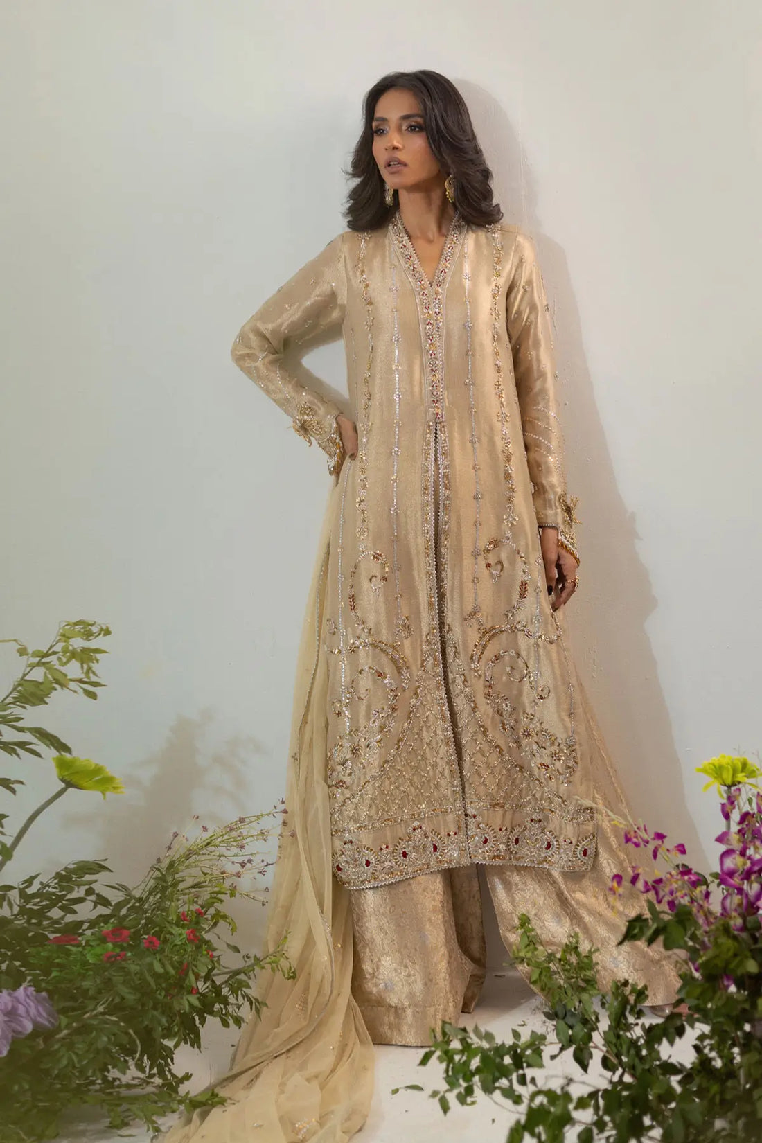 Gold lamé designer dress with antique zardozi, butterfly sleeves and flared pants styled for formal occasions
