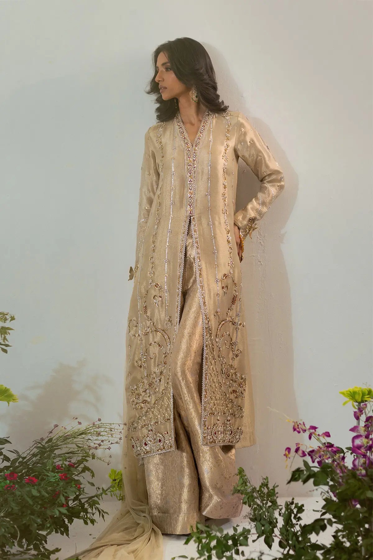 Gold lamé designer dress with antique zardozi, butterfly sleeves and flared pants styled for formal occasions