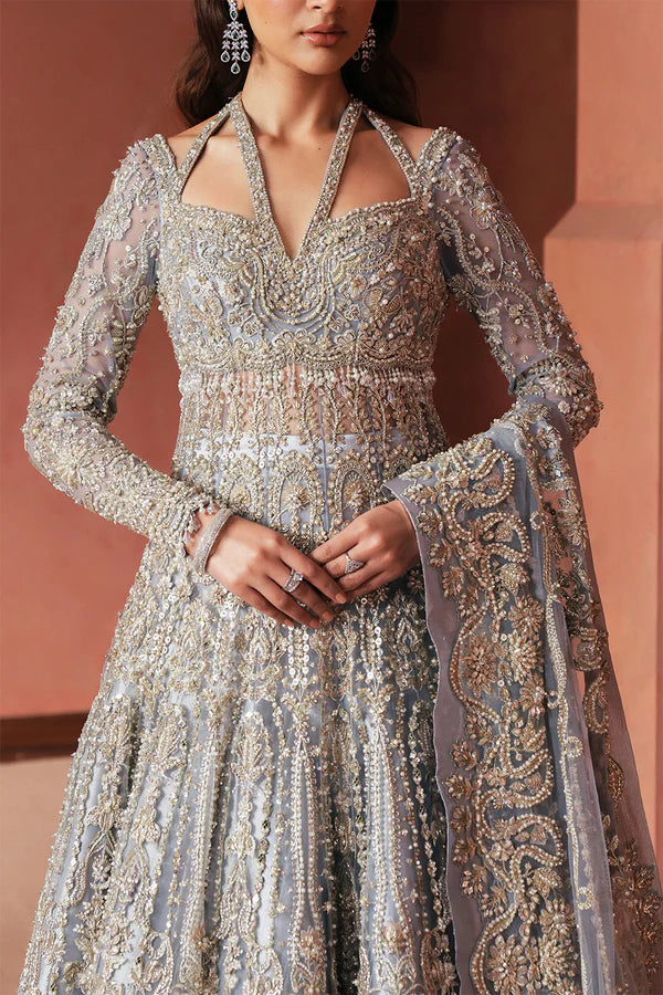 Designer moonlight blue Pakistani bridal lehenga for USA weddings, featuring a luxe tissue skirt and net dupatta, hand-embellished with naqshi and dabka embroidery.