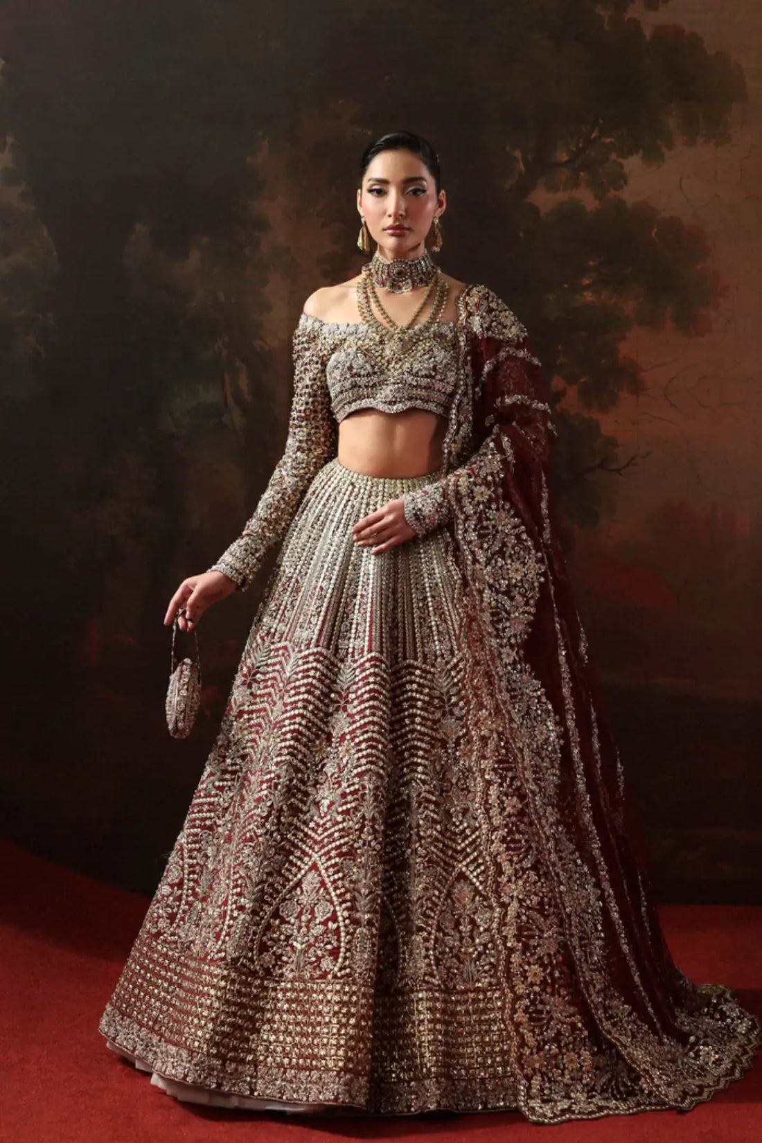 Arizel burgundy couture bridal lehenga choli from Akbar Aslam Serena Bridal Edit '26 crafted in organza with silk inner.