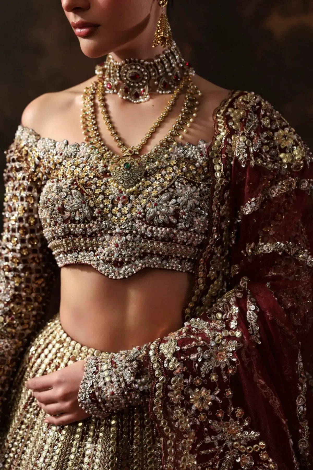 Arizel burgundy couture bridal lehenga choli from Akbar Aslam Serena Bridal Edit '26 crafted in organza with silk inner.