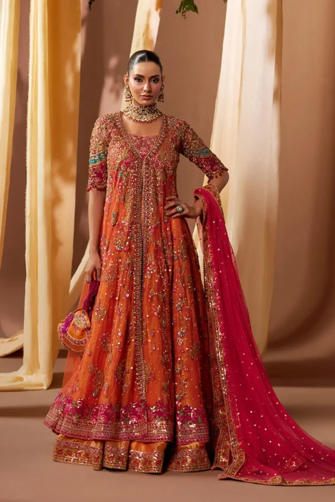 Asha Candy Orange Embellished Net Dholki Pishwas with Gold Zardozi Work, Lame Lehenga, Pink Net Dupatta and Embellished Pouch