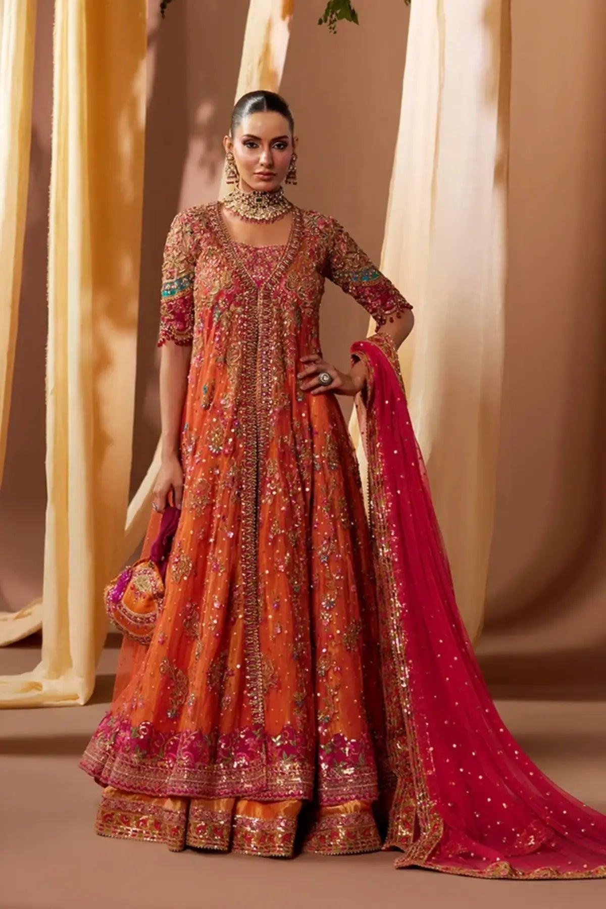 Asha Candy Orange Embellished Net Dholki Pishwas with Gold Zardozi Work, Lame Lehenga, Pink Net Dupatta and Embellished Pouch