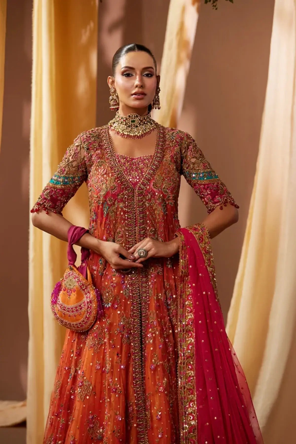 Asha Candy Orange Embellished Net Dholki Pishwas with Gold Zardozi Work, Lame Lehenga, Pink Net Dupatta and Embellished Pouch