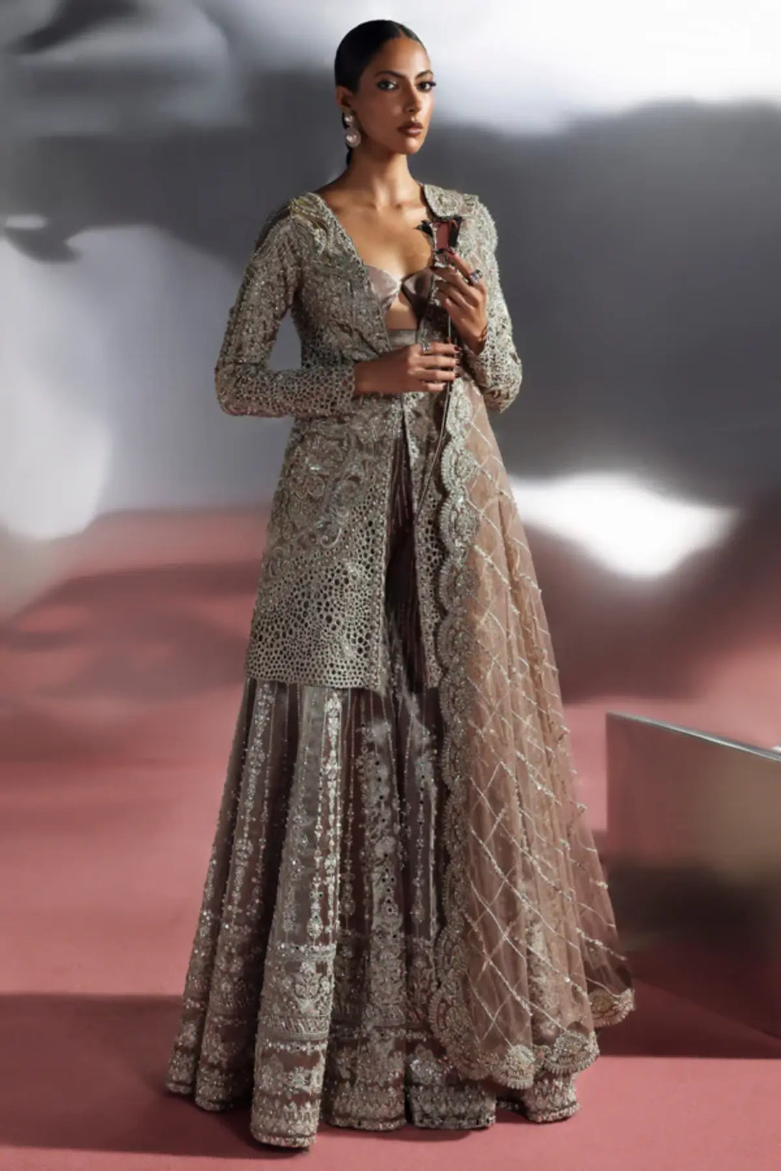 Astrell by Soraya gun metallic hand embellished sharara set with tissue jacket and net cutwork dupatta