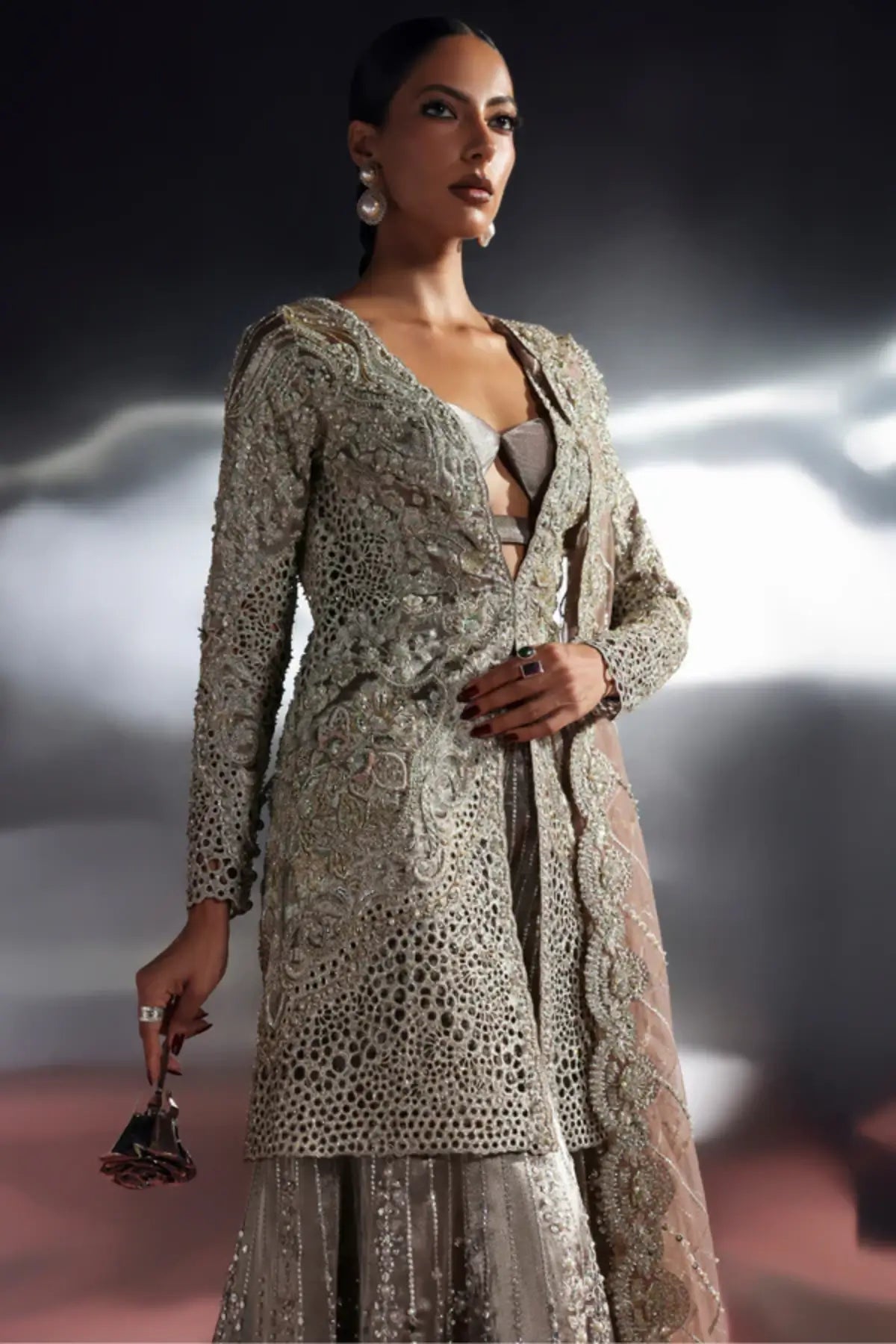 Astrell by Soraya gun metallic hand embellished sharara set with tissue jacket and net cutwork dupatta