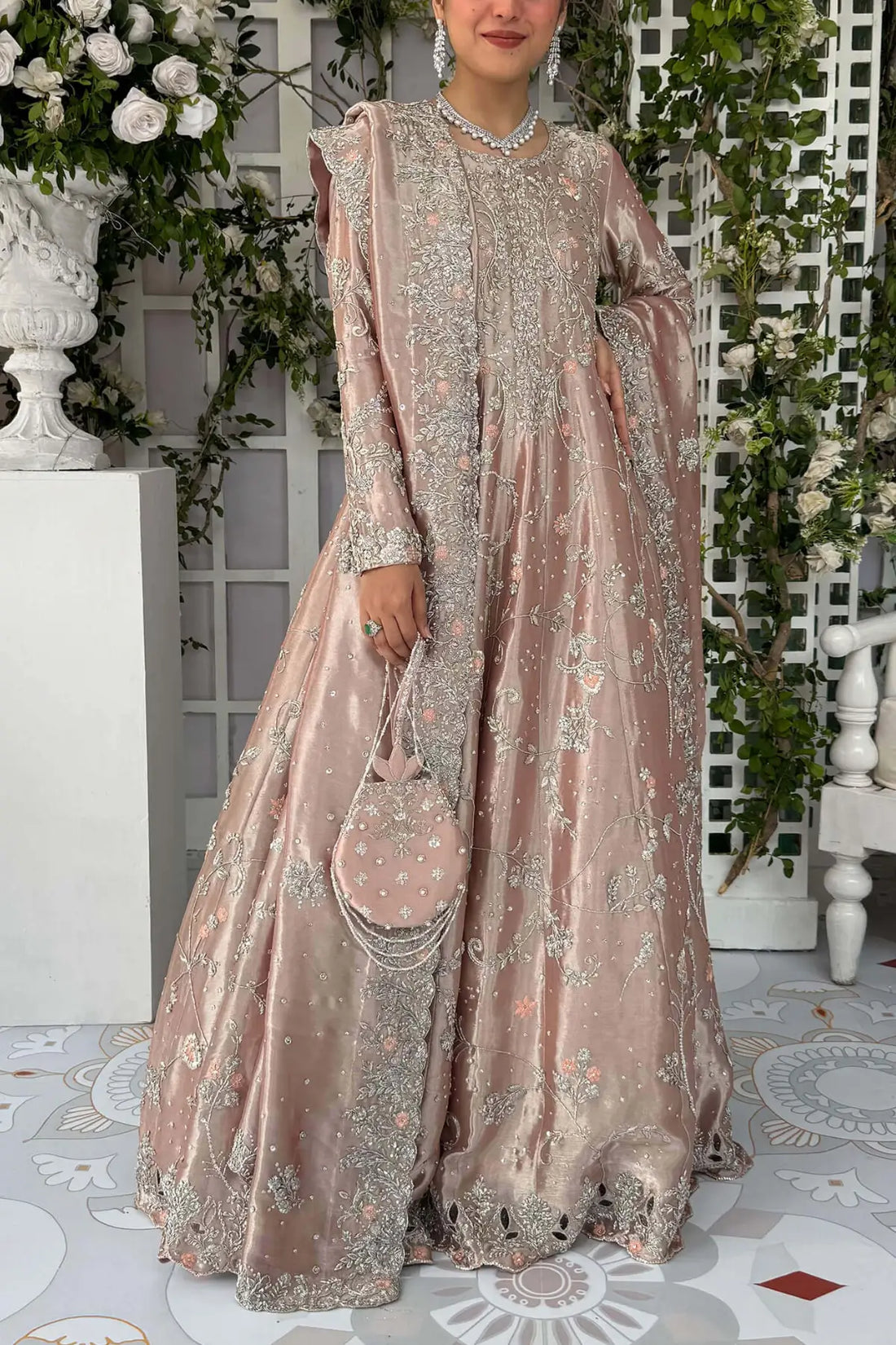 Ava blush pink Pakistani bridal stitched gown in pure lamé tissue with heavy neckline and Swarovski detailing.
