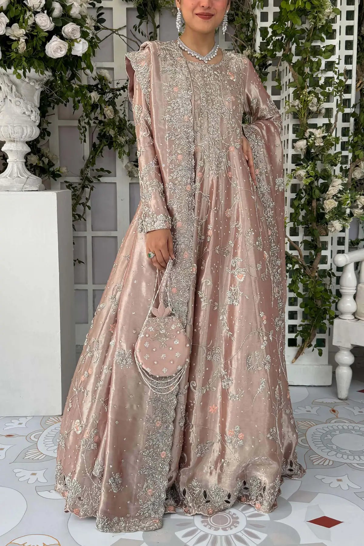 Ava blush pink Pakistani bridal stitched gown in pure lamé tissue with heavy neckline and Swarovski detailing.
