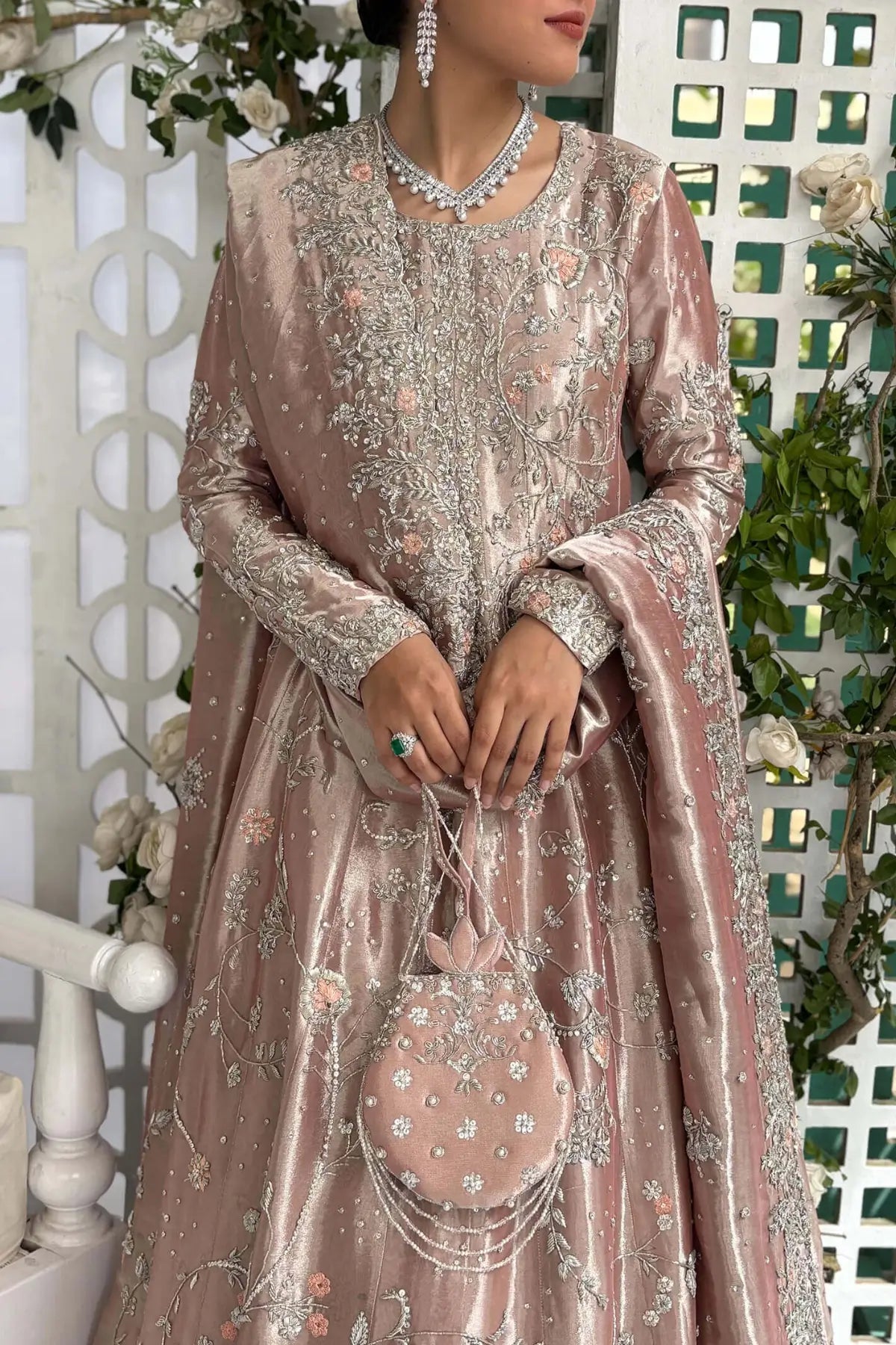 Ava blush pink Pakistani bridal stitched gown in pure lamé tissue with heavy neckline and Swarovski detailing.