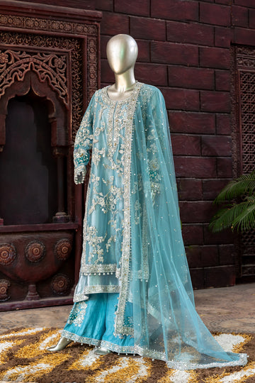 Teal Pakistani formal suit by MariamRaj featuring hand-embellished net shirt with zari, mirror work, pearls, and sequins, paired with tissue inner, embroidered pants, and a net dupatta.