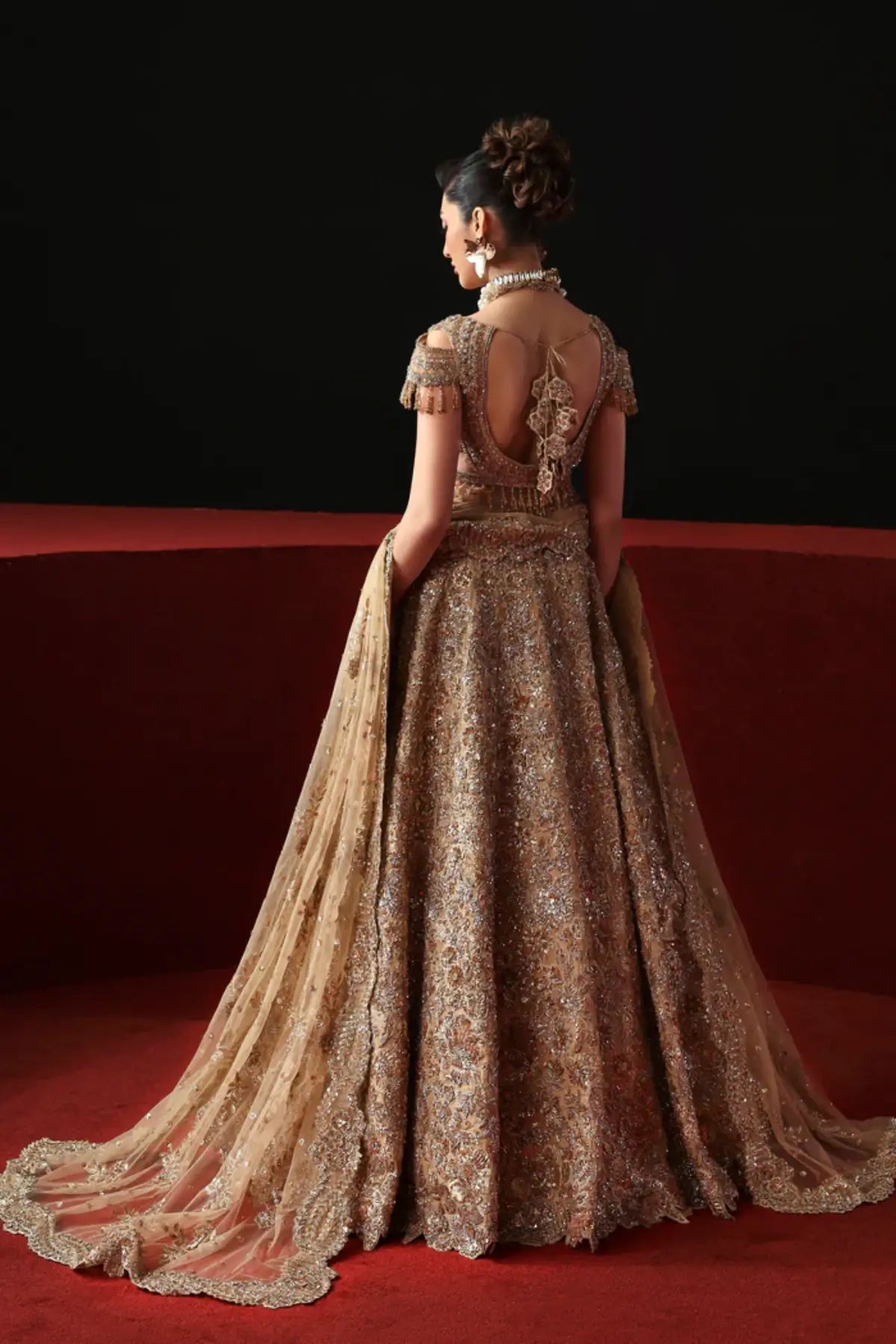 Aveline gold bridal stitched lehenga choli from Akbar Aslam Serena Bridal Edit '26 crafted in organza with silk inner.