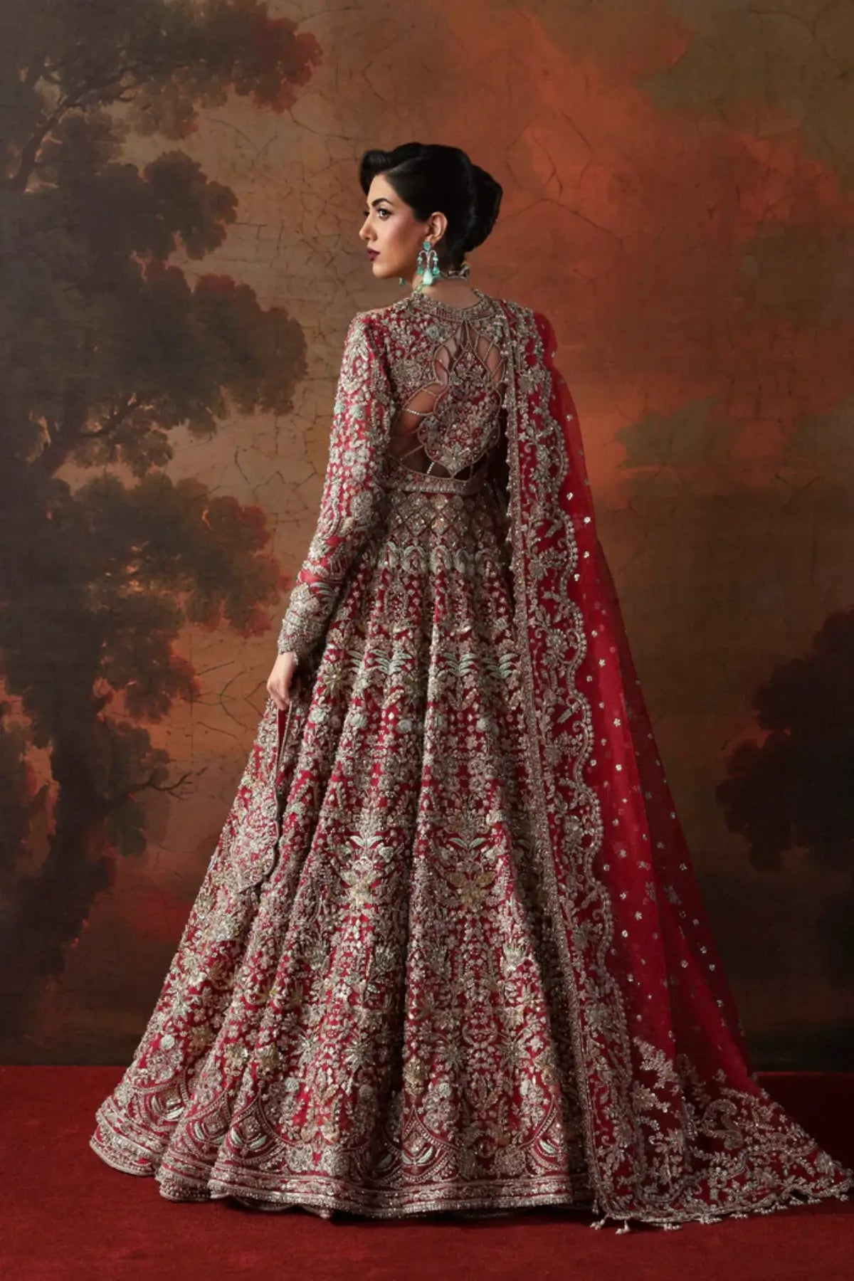 Avena crimson red bridal stitched lehenga from Akbar Aslam Serena Bridal Edit '26 crafted in organza with silk inner.