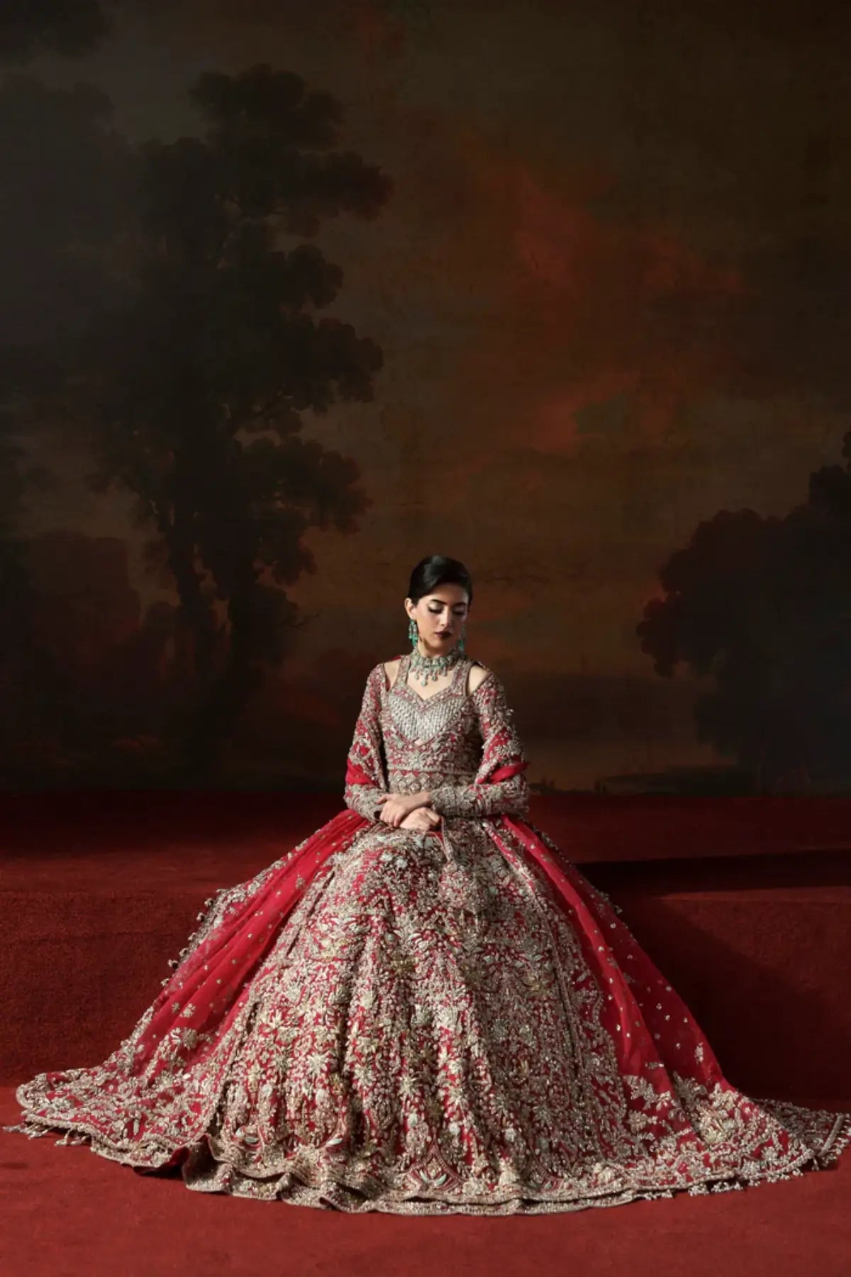 Avena crimson red bridal stitched lehenga from Akbar Aslam Serena Bridal Edit '26 crafted in organza with silk inner.