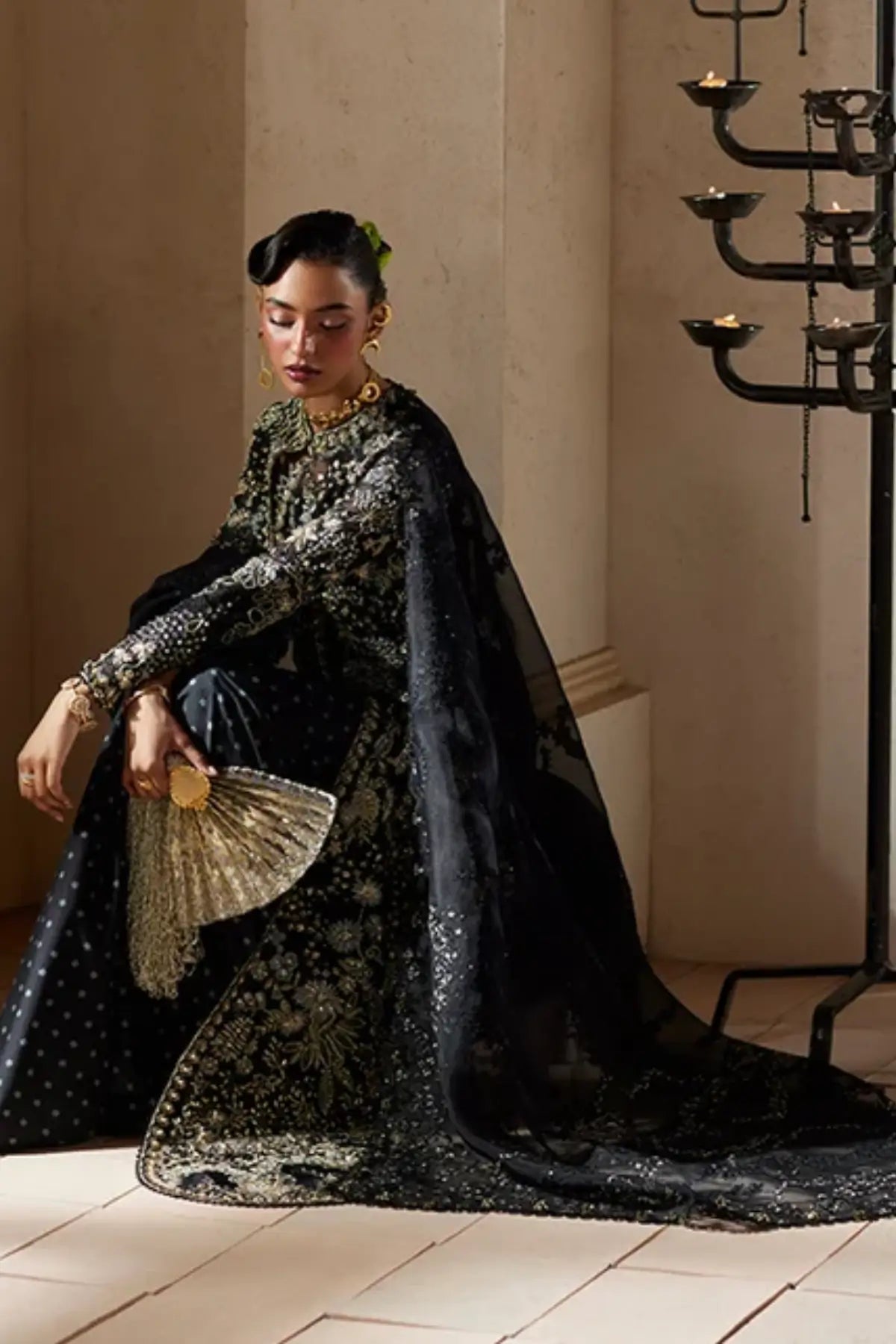 Avinaa black embroidered organza wedding formal gown with blue grey embroidery, gold embellishments, net drape and raw silk trousers