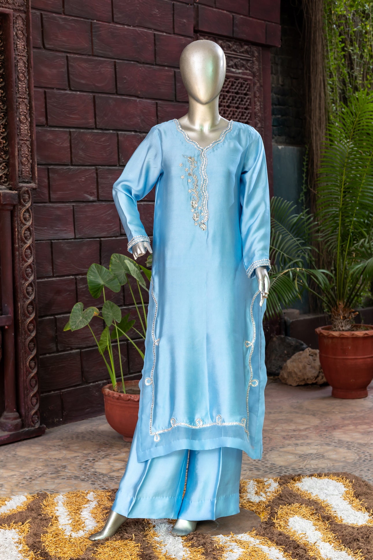 Sky blue Pakistani sheesha silk suit with vertical neckline embroidery, sleeve and side panel work, and pearl-detailed organza dupatta by MariamRaj for festive wear in the USA.