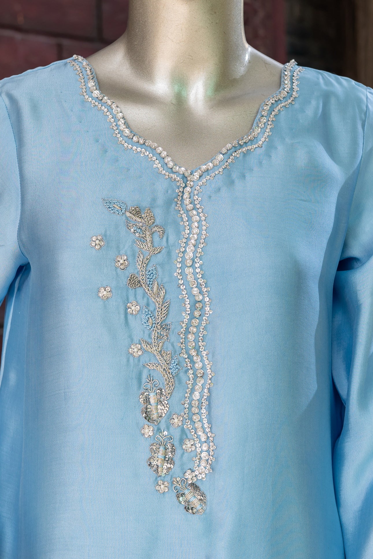 Sky blue Pakistani sheesha silk suit with vertical neckline embroidery, sleeve and side panel work, and pearl-detailed organza dupatta by MariamRaj for festive wear in the USA.