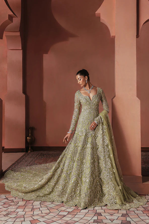 Sage green Pakistani bridal trail gown for USA brides in soft net, hand-embellished with naqshi, dabka, mirror work, mukesh, cutwork, and 3D detailing for a graceful wedding look.