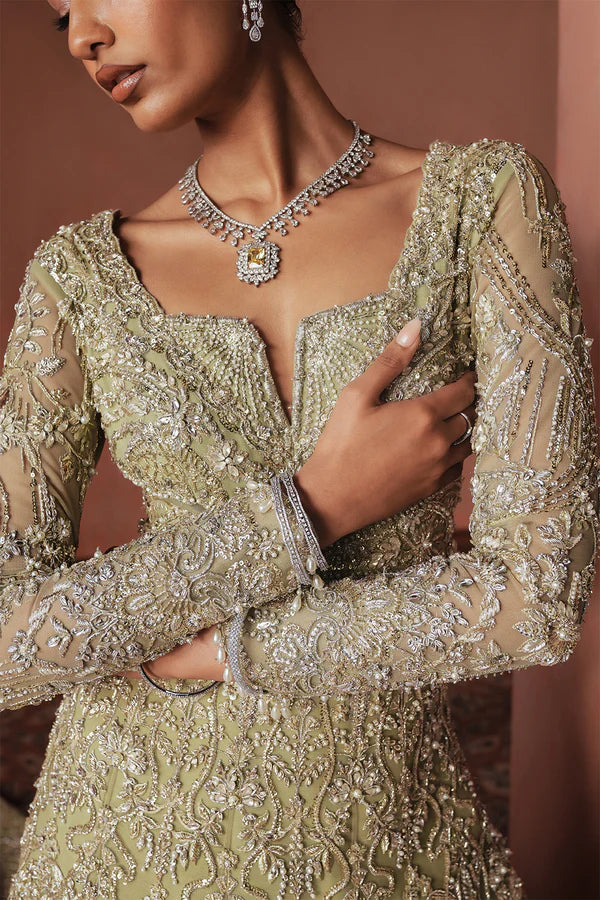 Sage green Pakistani bridal trail gown for USA brides in soft net, hand-embellished with naqshi, dabka, mirror work, mukesh, cutwork, and 3D detailing for a graceful wedding look.