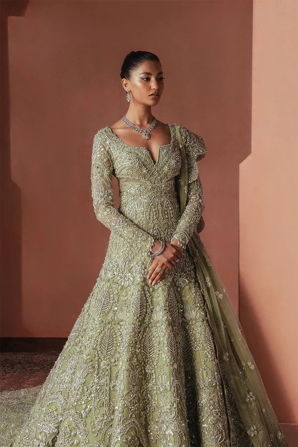 Sage green Pakistani bridal trail gown for USA brides in soft net, hand-embellished with naqshi, dabka, mirror work, mukesh, cutwork, and 3D detailing for a graceful wedding look.