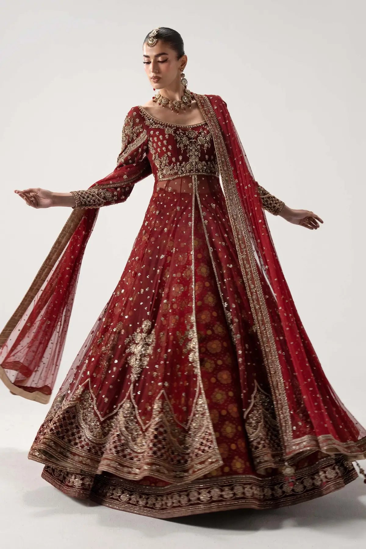 Bazif deep red royal bridal pishwas lehenga set with jamawar lehenga and net dupatta by Maria B