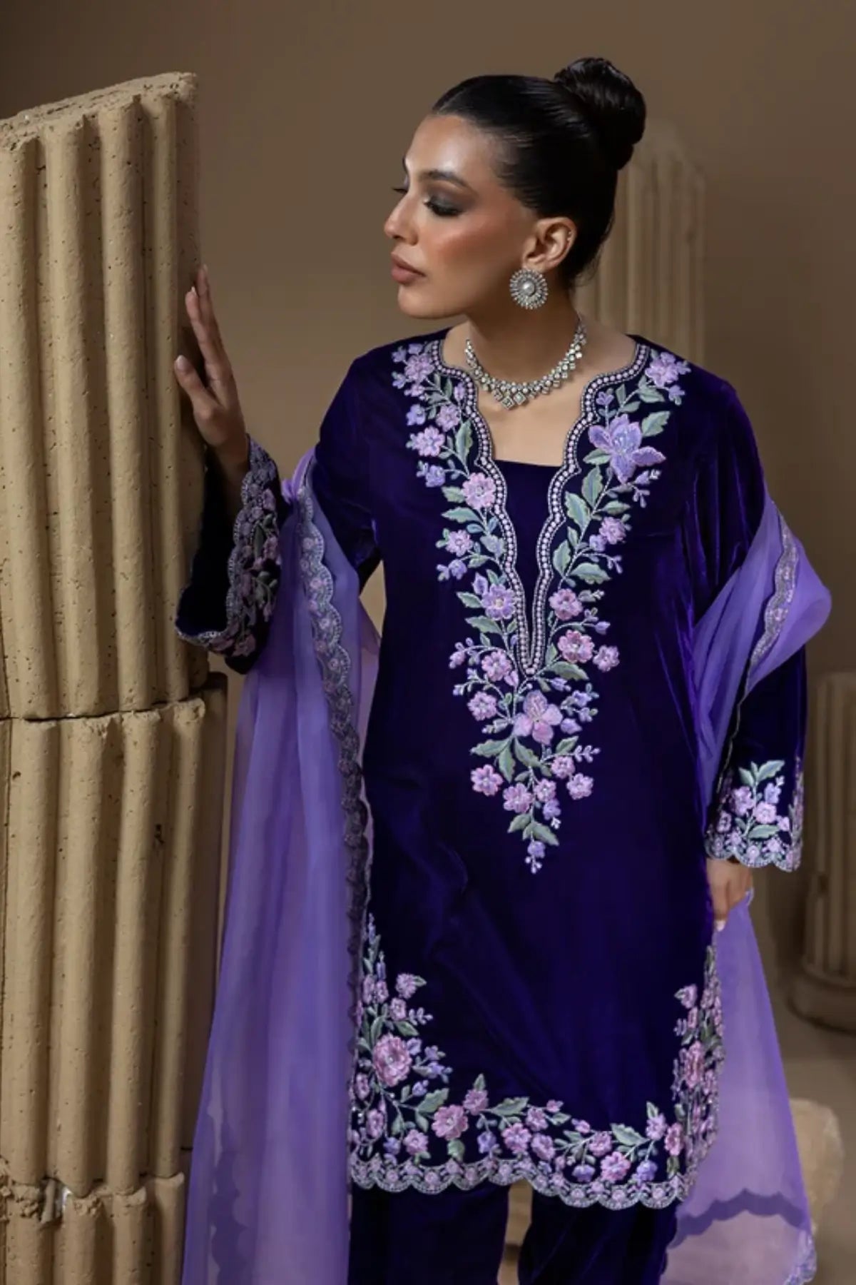 Benafsha deep purple velvet shalwar kameez with pastel floral resham embroidery, matching velvet shalwar and lavender organza dupatta.